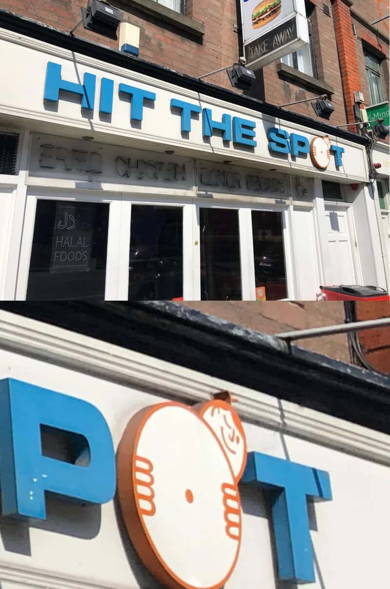 Sign reading 'HIT THE SPOT' with a cartoon fried egg logo.