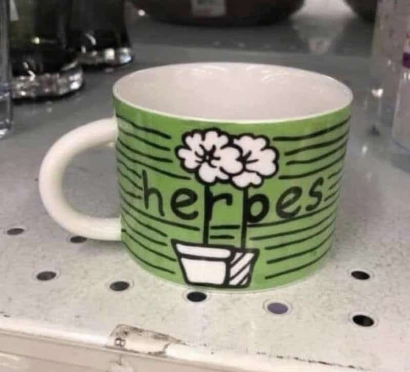 Mug with a plant drawing and the word 'herbes' on it.