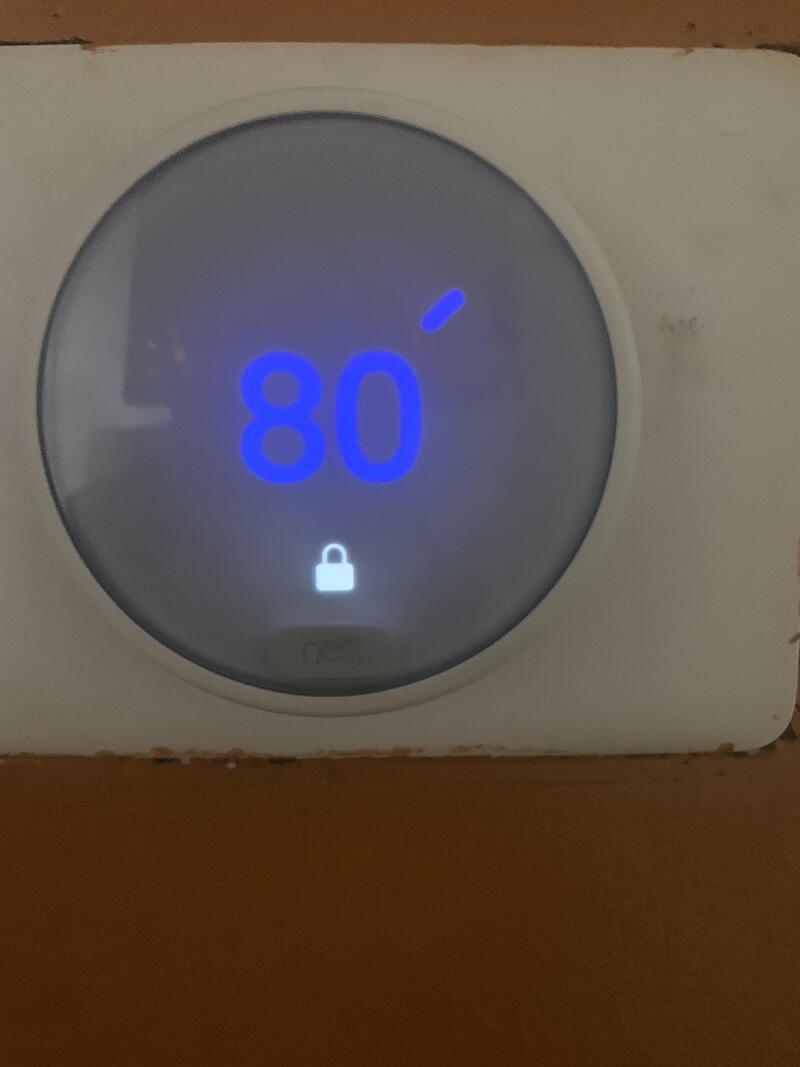 Thermostat set to 80 degrees with a lock icon below the display.