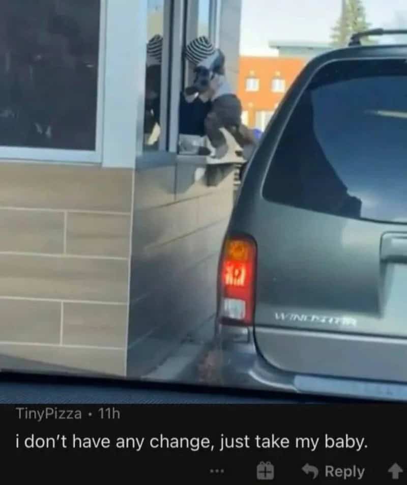 Child climbing on a window ledge outside a building, with a car parked nearby.