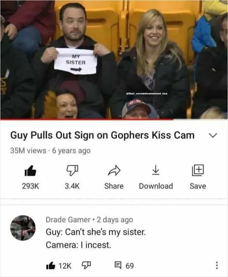 Man holds sign saying 'My Sister' at hockey game, woman smiling nearby.