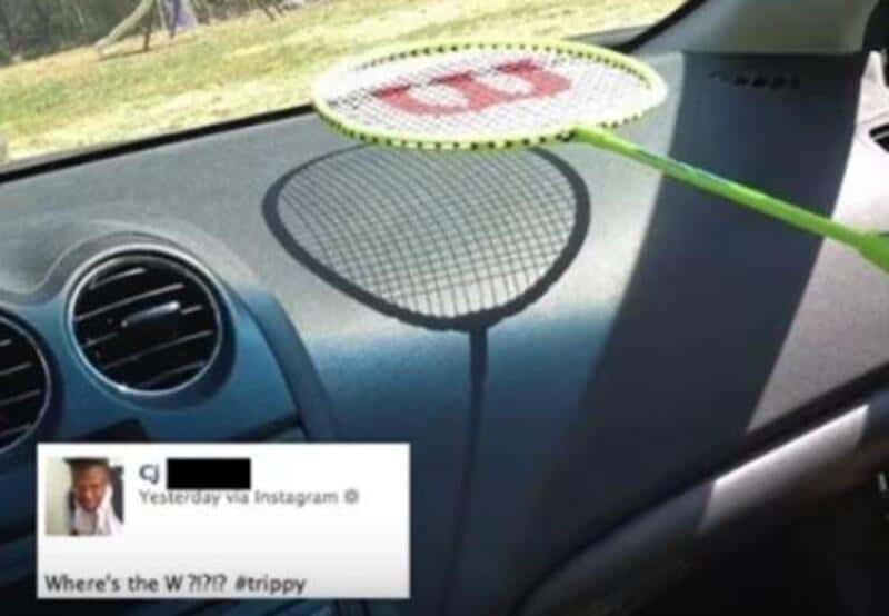 A badminton racket and shuttlecock on a car dashboard, with a social media post overlay.