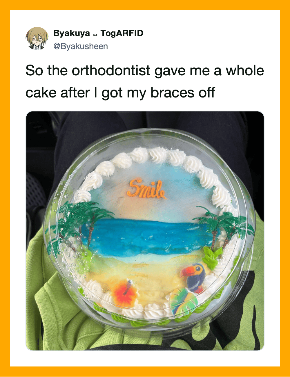Cake with ocean scene, palm trees, and the word 'Smile' on top.