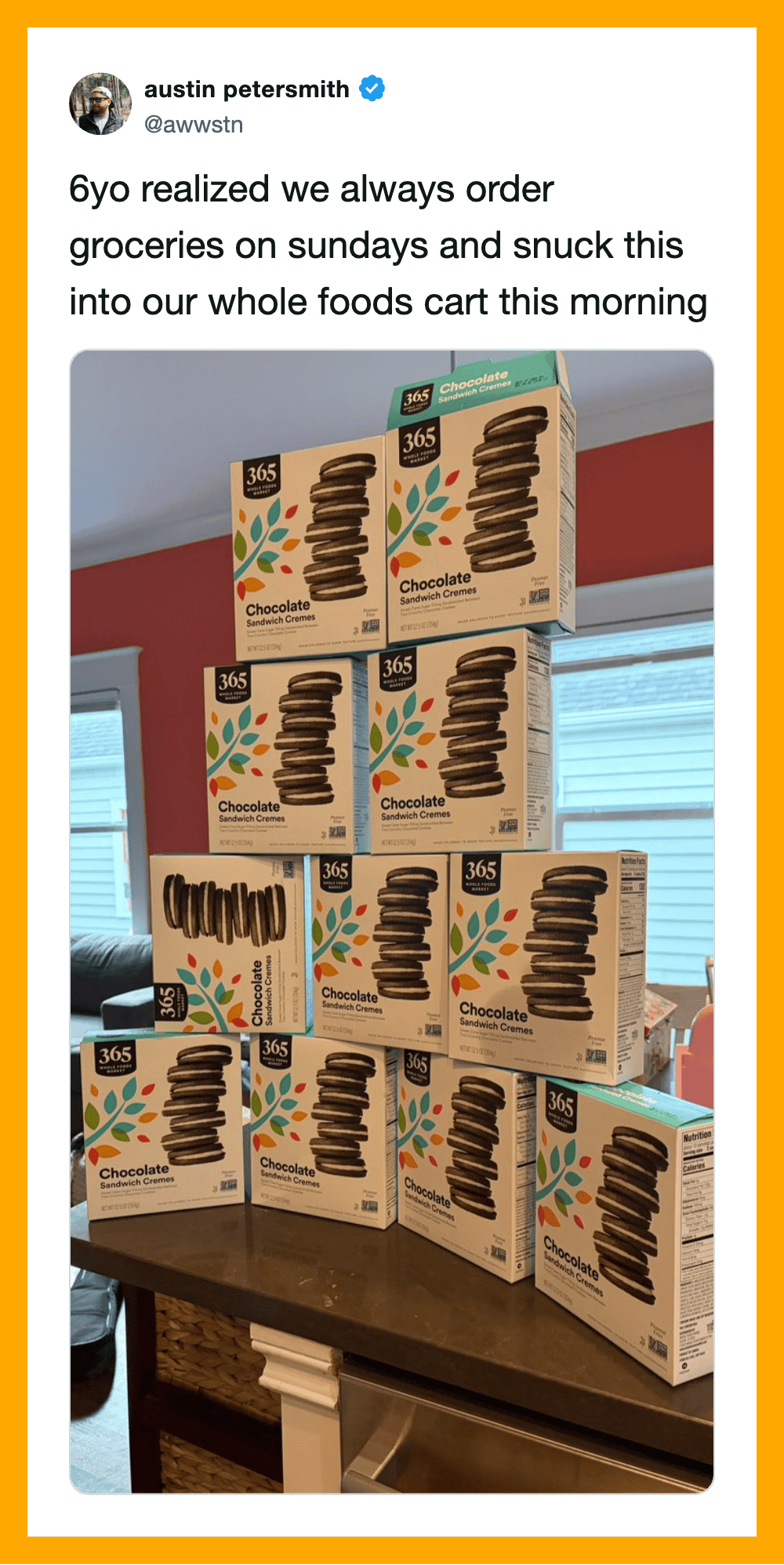 Stacked boxes of 365 Everyday Value chocolate cookies on a kitchen counter.