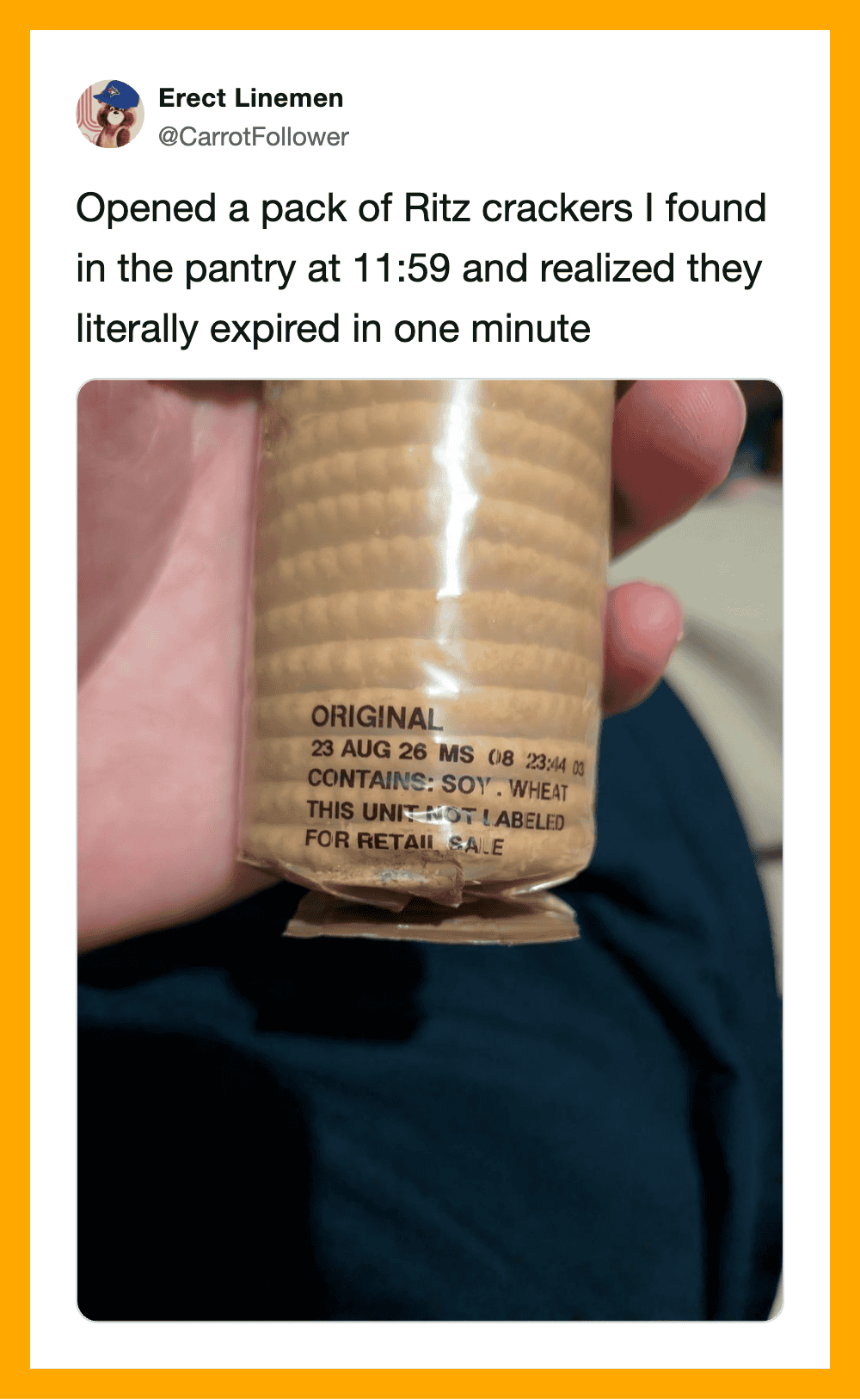 Pack of Ritz crackers with expired date, held in hand.