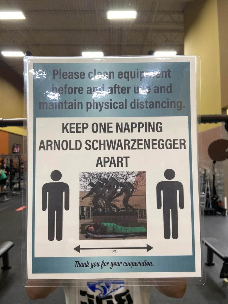 Sign reminding to keep one napping Arnold Schwarzenegger apart at gym.