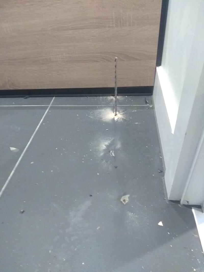 A water pipe burst causing water to spray onto the floor.