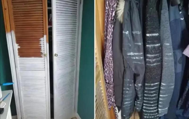 Clothes hanging on a rack and a broken closet door with slats missing.
