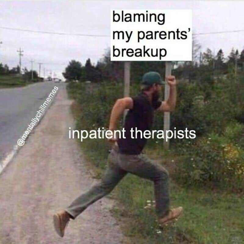 Person running with a sign saying blaming my parents' breakup inpatient therapists.