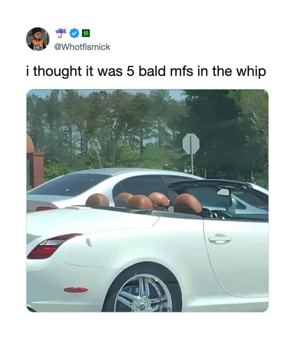 White convertible car with five bald heads on the back seats, captioned 'i thought it was 5 bald mfs.