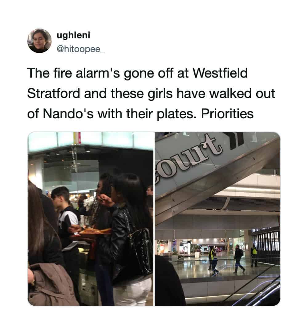 Girls walking out of Nando's with plates at Westfield Stratford after fire alarm.