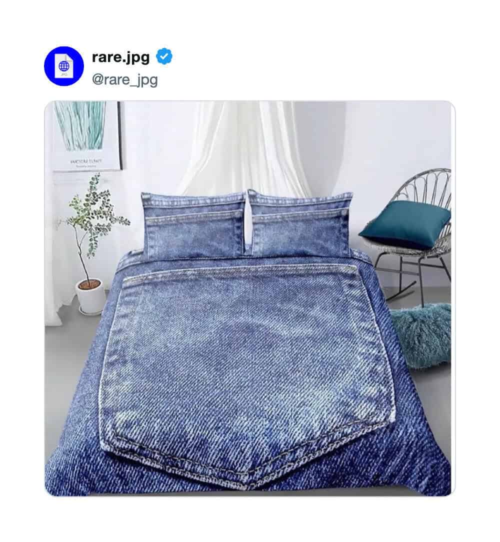 Bed made with denim jeans, with a pillow and chair in the background.