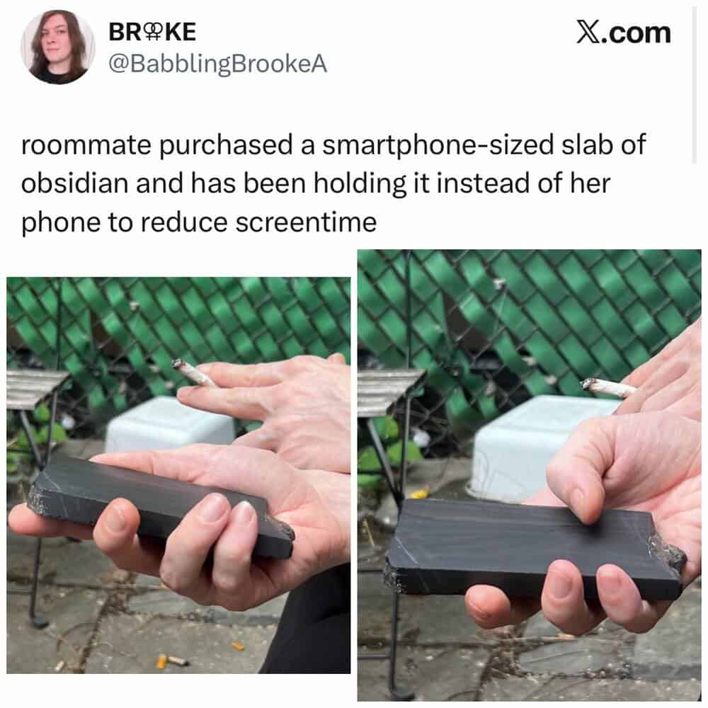 Roommate holds a smartphone-sized obsidian slab instead of her phone.