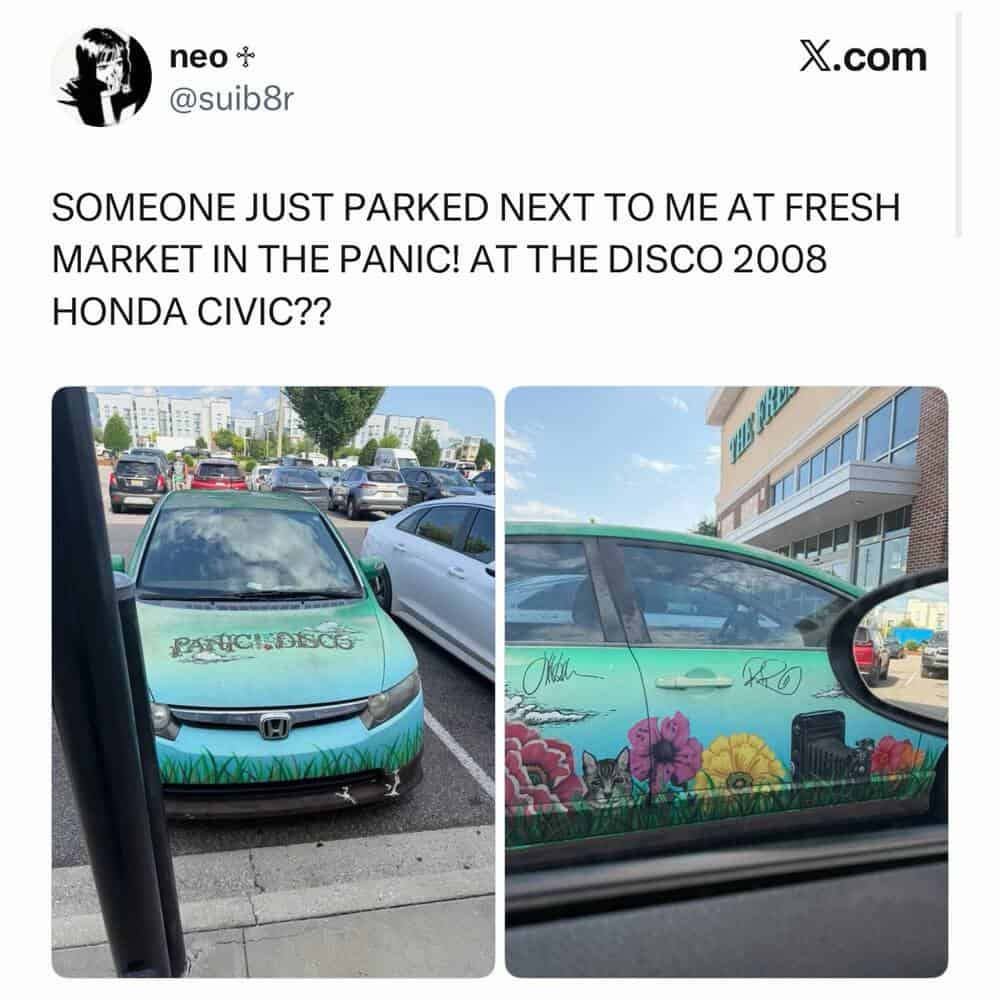 Car with colorful floral and animal graffiti at fresh market parking lot.