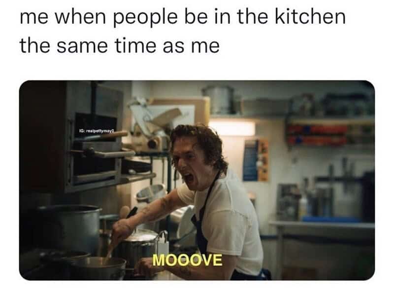 Person in a kitchen shouting MOOVVE while cooking.