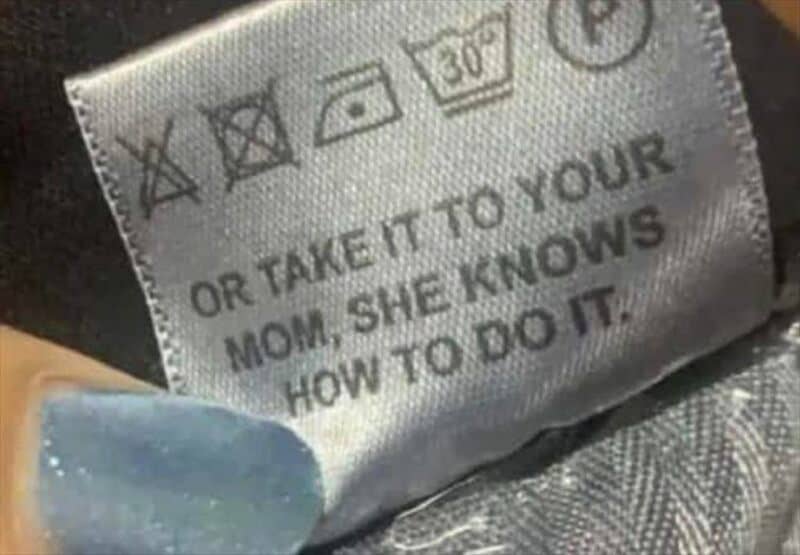 Clothing care label with humorous message about a mom knowing how to do it.