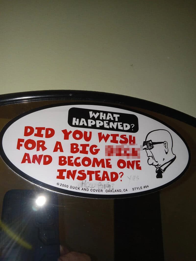 Sign with humorous message about wishing for a big [redacted] and becoming one instead.