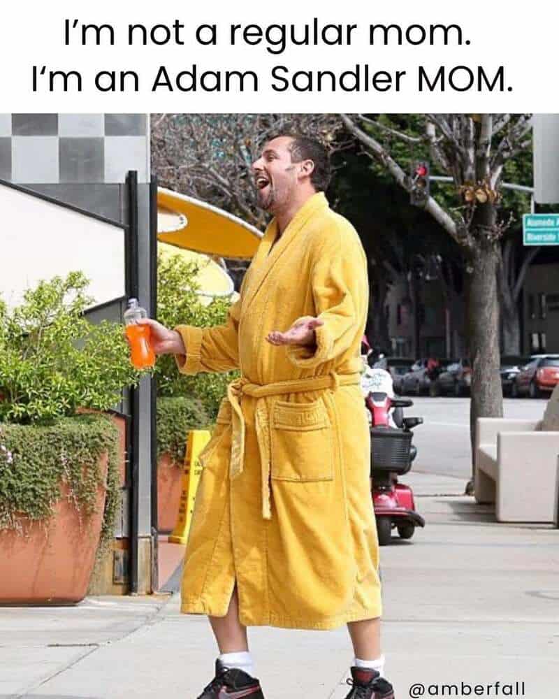Man in yellow bathrobe holding drink, laughing, with text about Adam Sandler MOM.