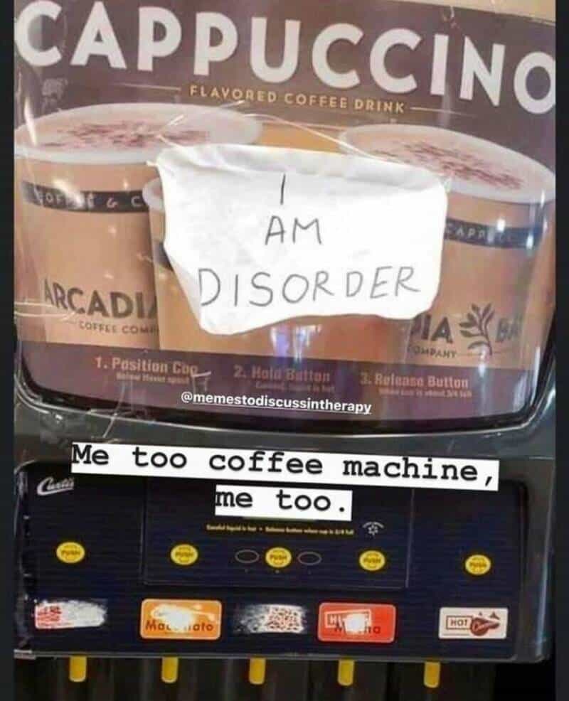 Sign on coffee machine says 'I AM DISORDER' with a note and caption about coffee machine.