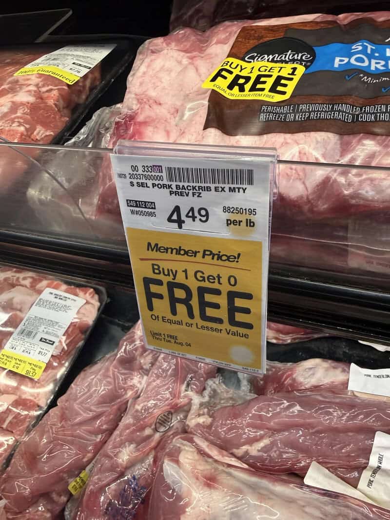 Pork back ribs on display with buy 1 get 1 free sign.