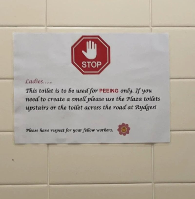 Sign indicating toilet is for peeing only, with instructions and a stop sign.