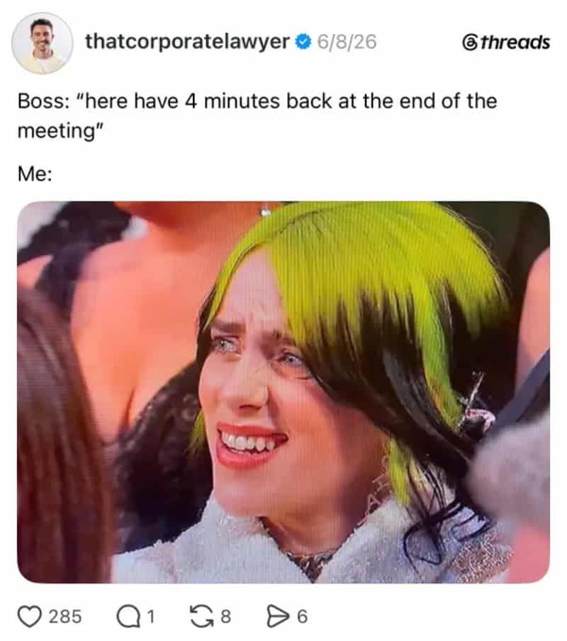 Woman with green and black hair looking confused or upset.