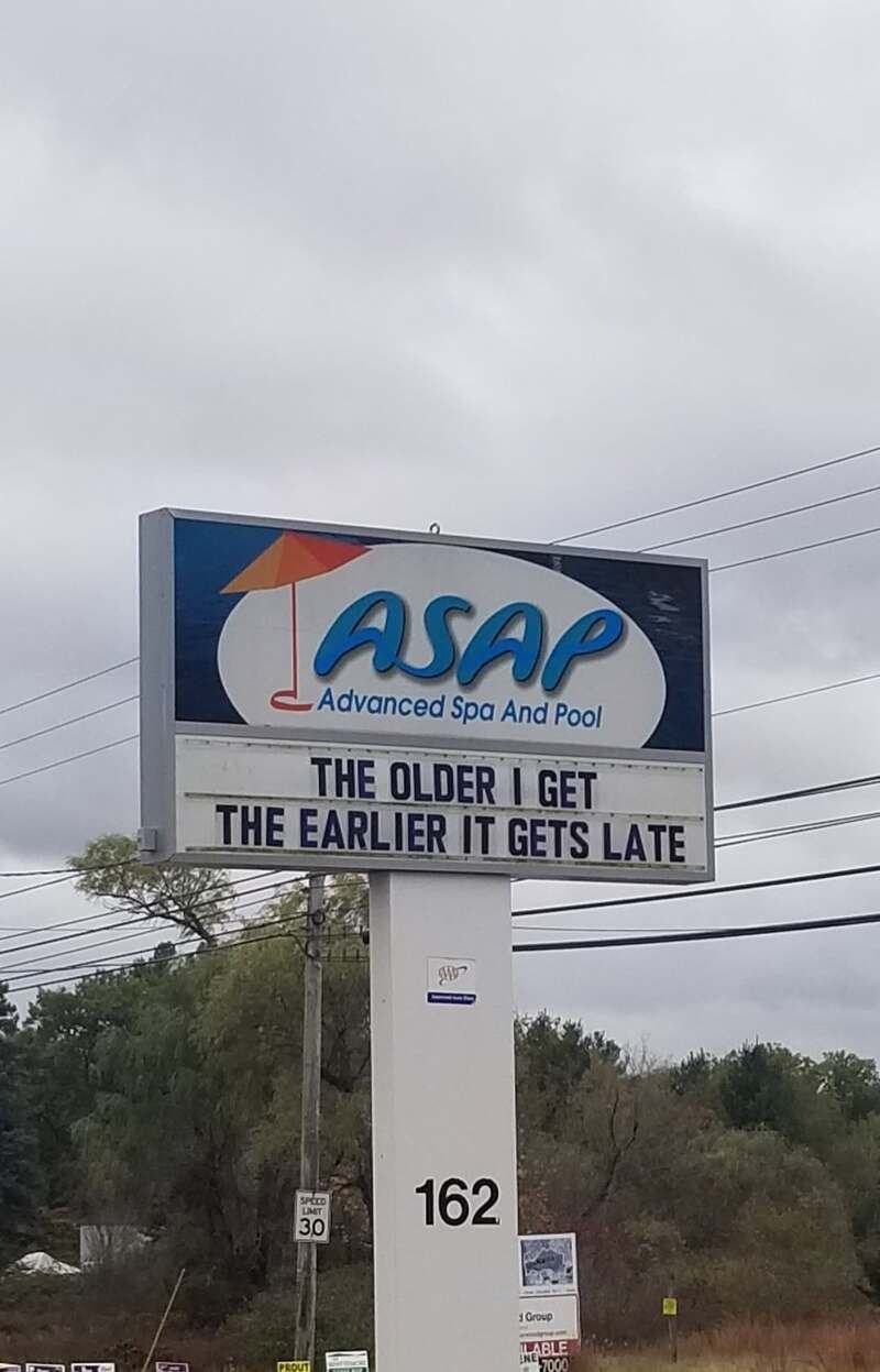 Sign for ASAP Advanced Spa and Pool with a humorous message about aging.
