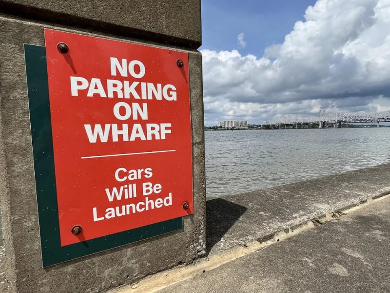 No parking on wharf. Cars will be launched sign near water.