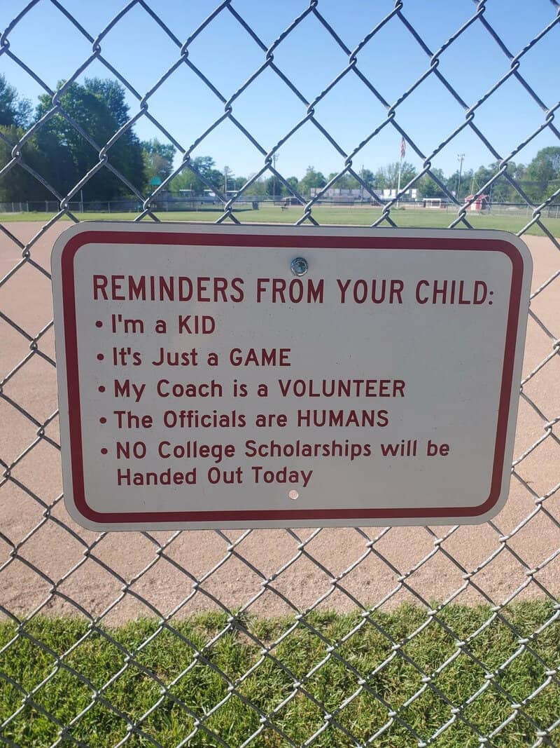 Reminders from your child sign at a baseball field.