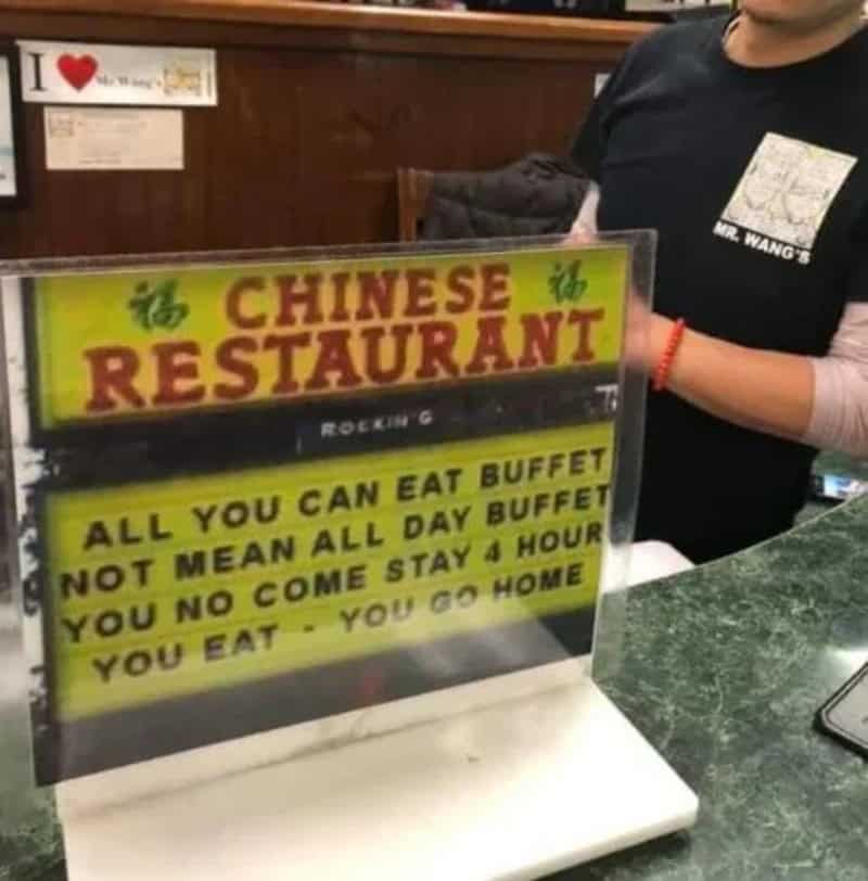 Sign for Chinese restaurant with humorous rules about buffet eating.