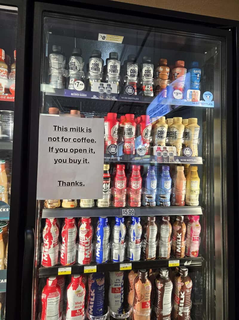 Sign on milk fridge: This milk is not for coffee. If you open it, you buy it. Thanks.