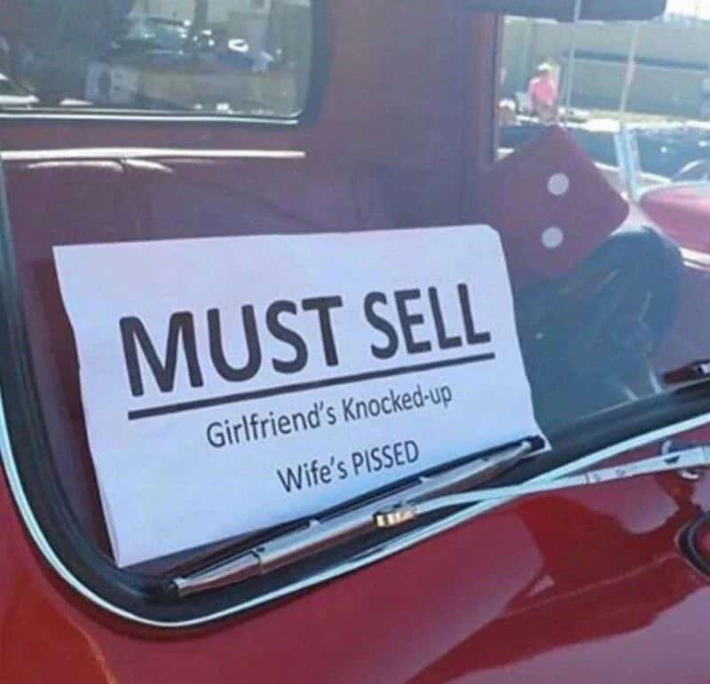 Must sell sign on car window with humorous reasons: girlfriend's knocked-up, wife's PISSED.