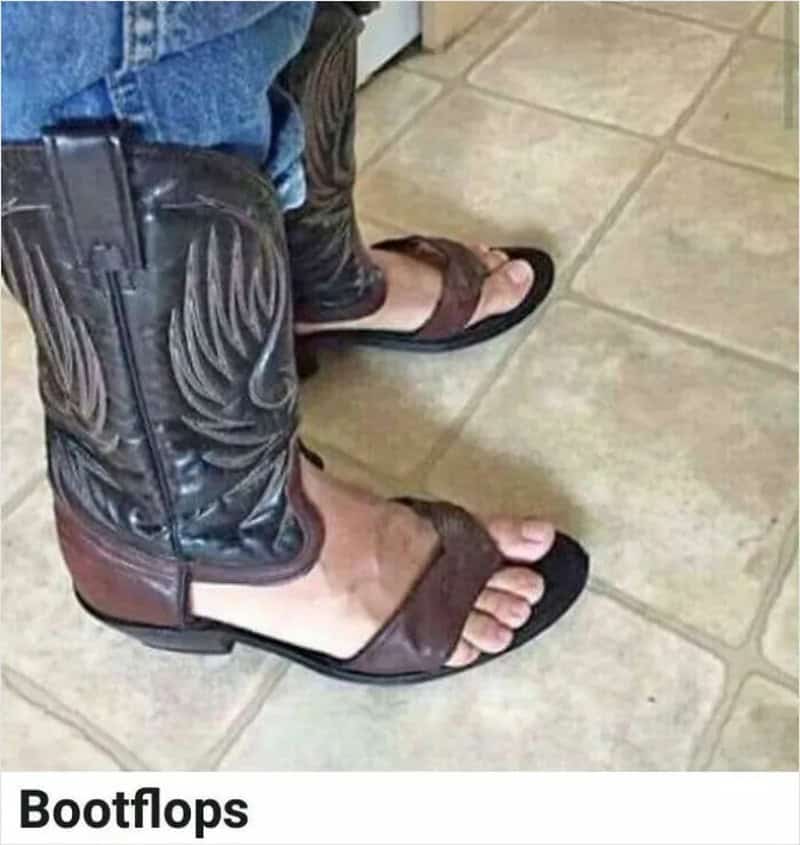 Person wearing cowboy boots with toes exposed, standing on tiled floor.