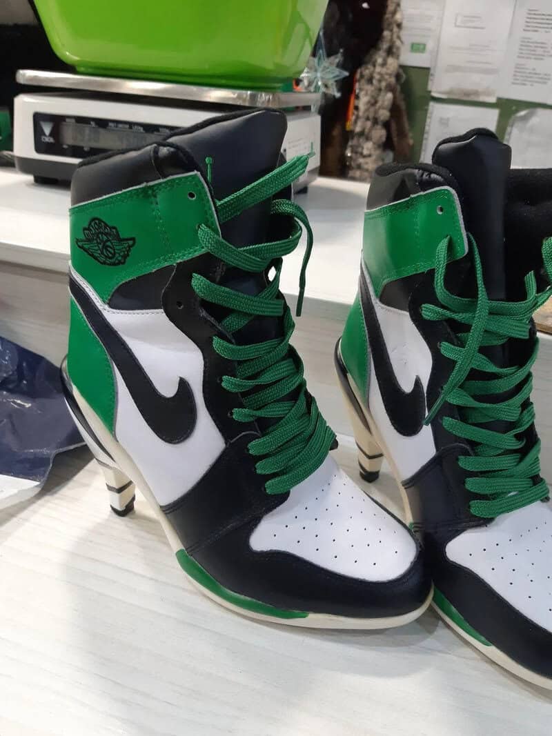 Sneaker shoes designed to look like a basketball shoe with green, black, and white colors.