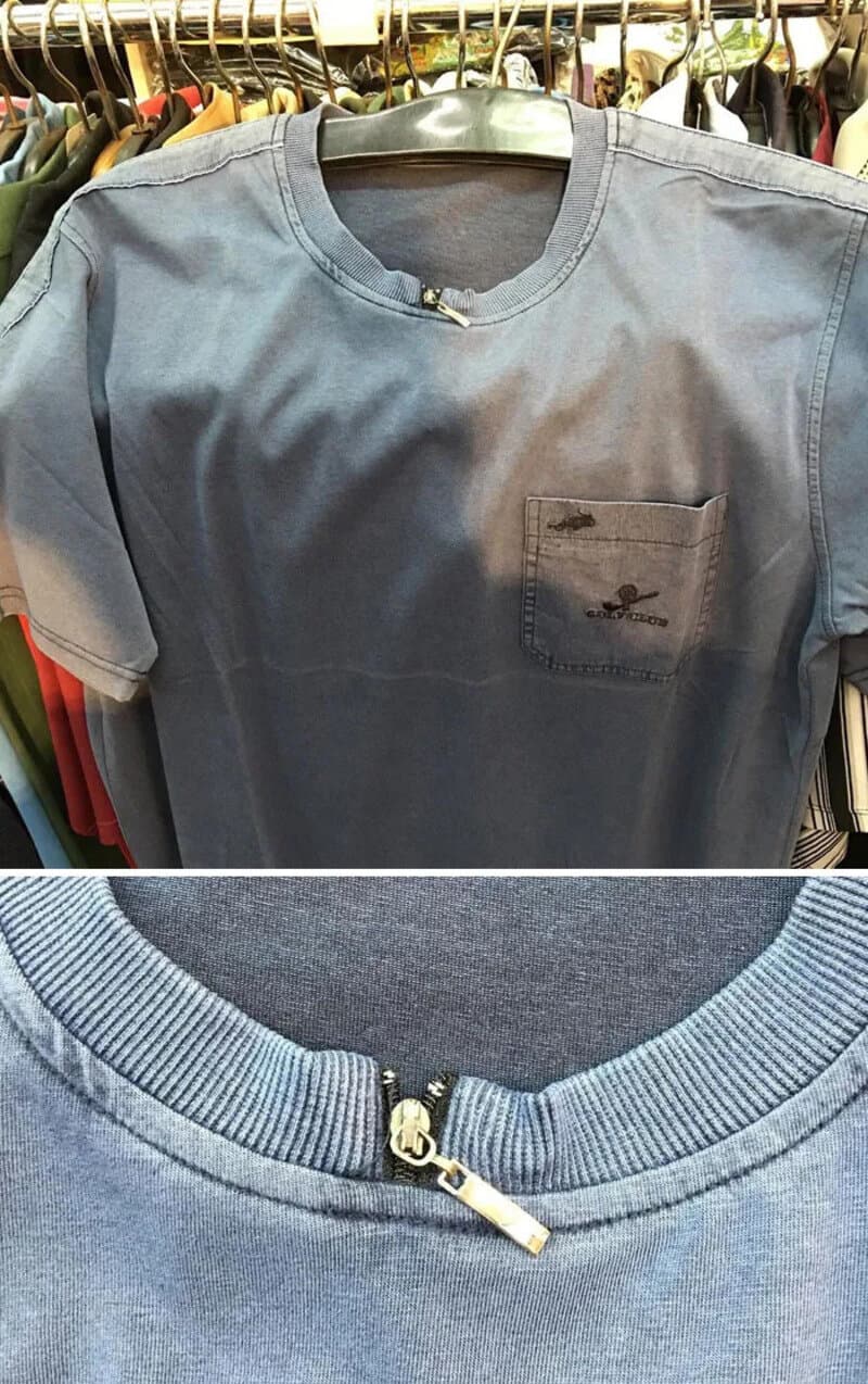 Blue T-shirt with a small pocket and a zipper at the collar.