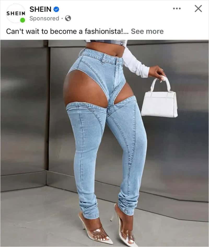 Fashionable jeans with cutouts revealing thighs and hips, paired with high heels and a white top.
