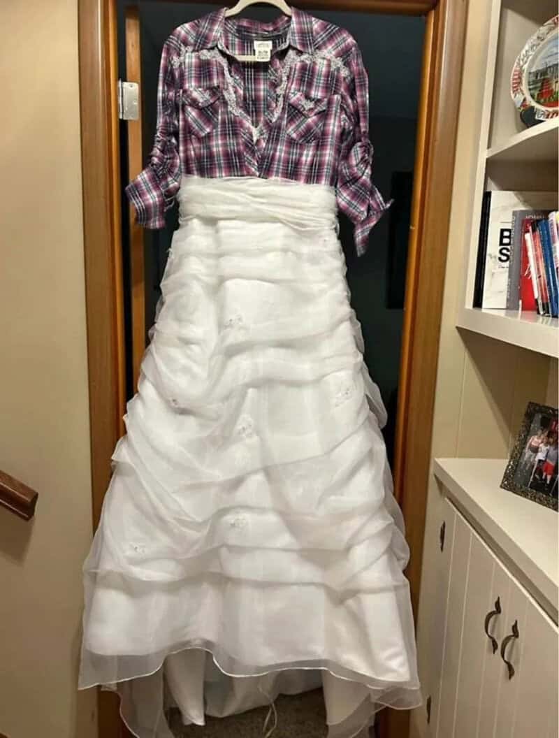 A dress with a plaid shirt top and a white layered skirt.