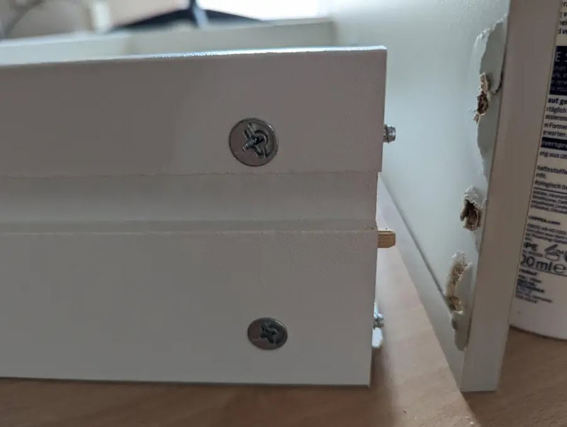  drawer misaligned and screws not properly fixed.