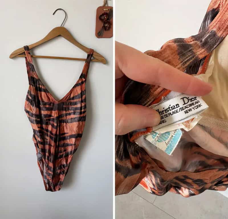 Vintage Christian Dior swimsuit with tiger stripe pattern on hanger.