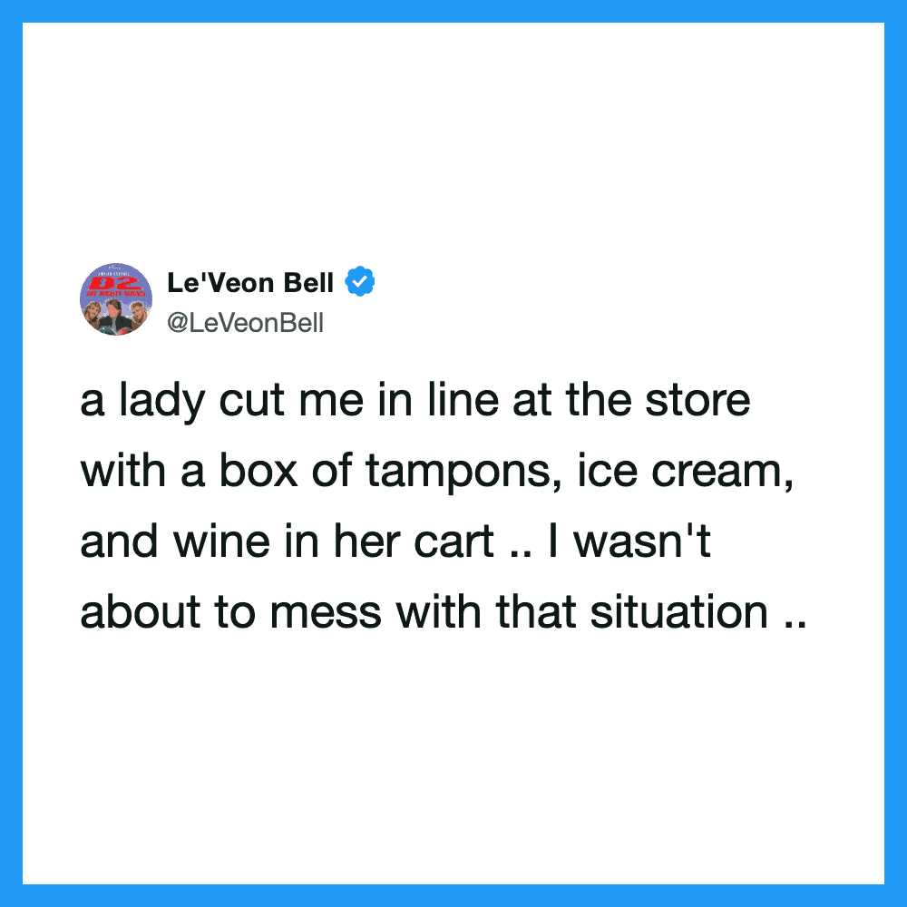 A woman in line at a store with tampons, ice cream, and wine in her cart.
