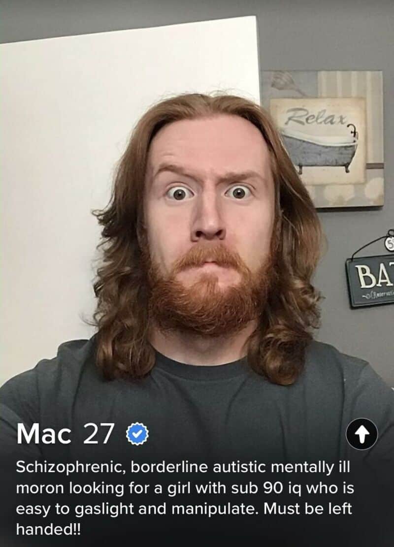 A man with long hair and a beard making a surprised face.