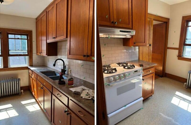 Kitchen with wooden cabinets, white tile backsplash, and a window with sunlight.
