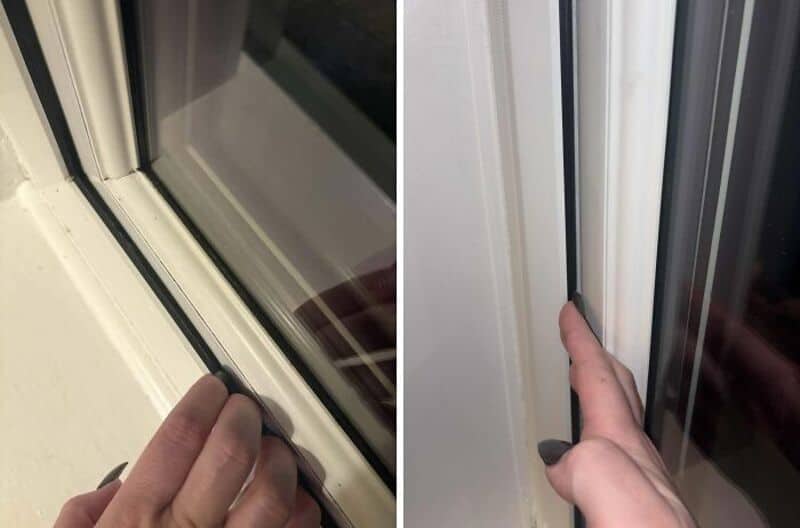 Close-up of a hand pulling a window seal on a sliding door.