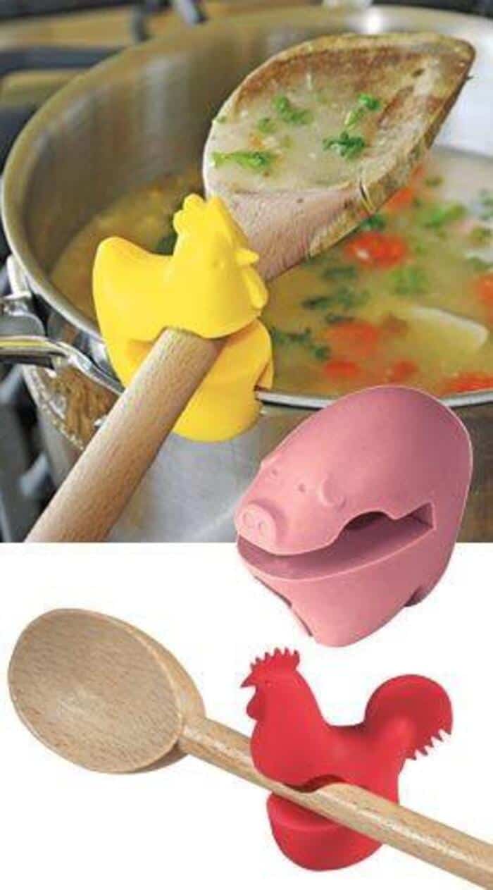 Colorful kitchen utensils including a wooden spoon, pig-shaped container, and rooster-shaped spoon.