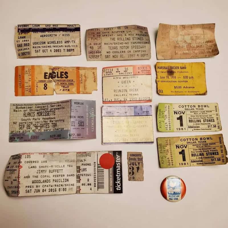 Collection of vintage concert and event tickets with various designs and dates.