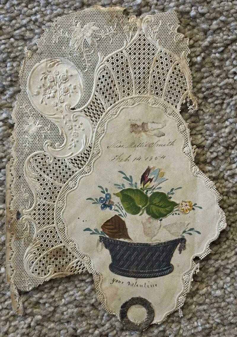 Vintage lace card with floral illustration and handwritten note, 'In affectionate memory, Feb 14 185.
