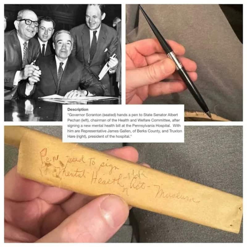 Black and white photo of Governor Scranton signing a document with four men around him.