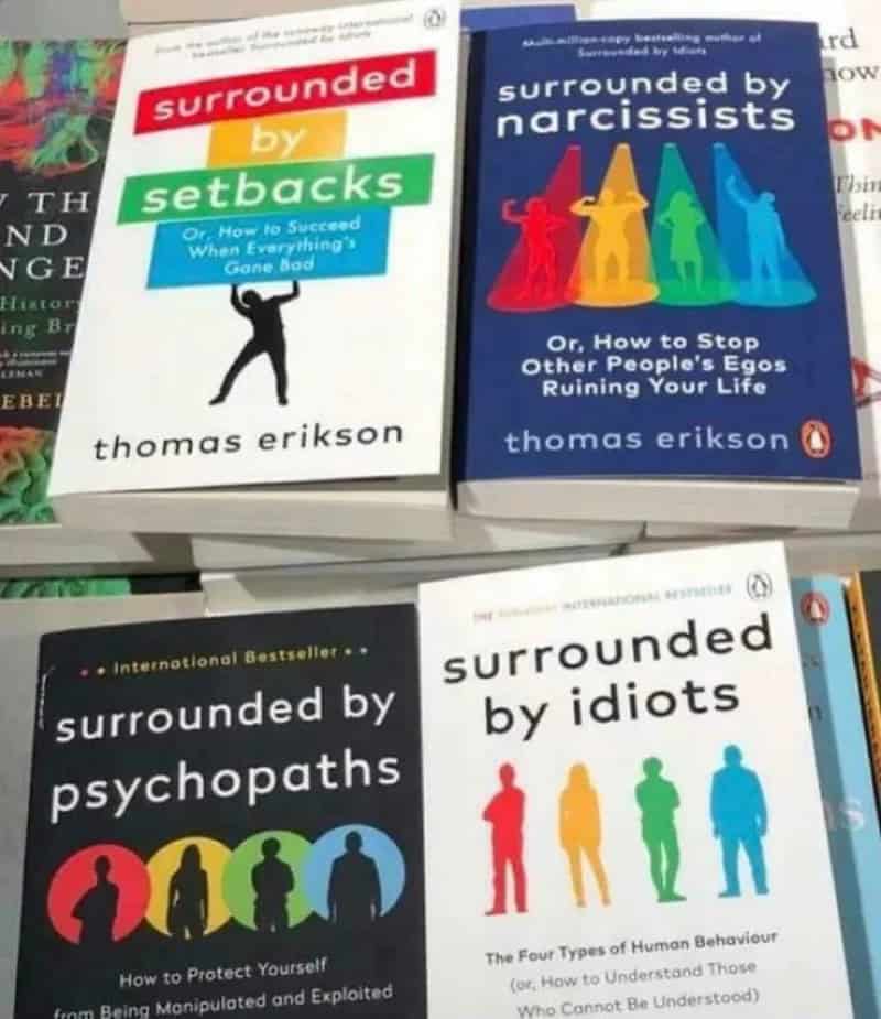 Four books on a shelf about narcissists, psychopaths, idiots, and setbacks.