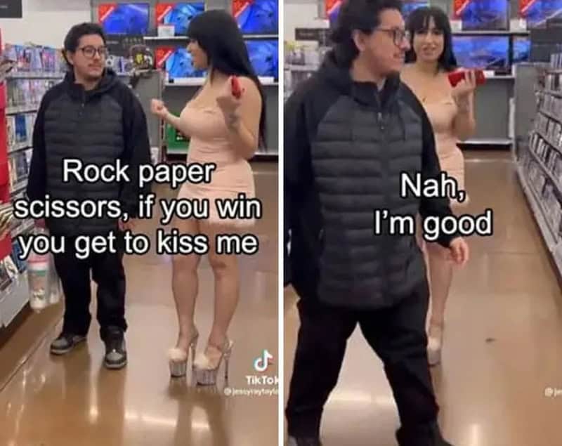 Woman in beige dress and heels challenges man with rock paper scissors for a kiss.