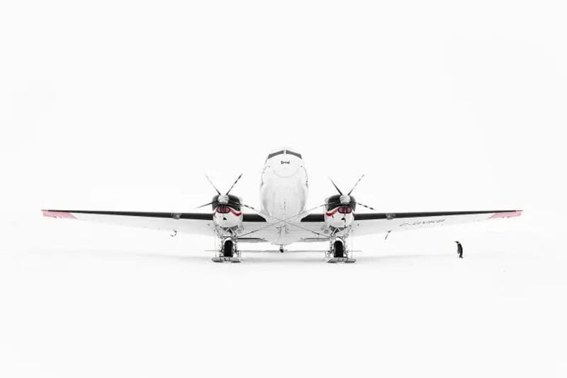 Airplane on snow with a minimalist background, part of minimalist-photography-awards-2026.